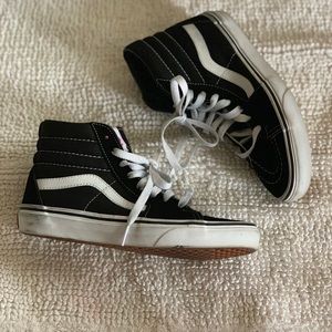 Black and white high top vans
